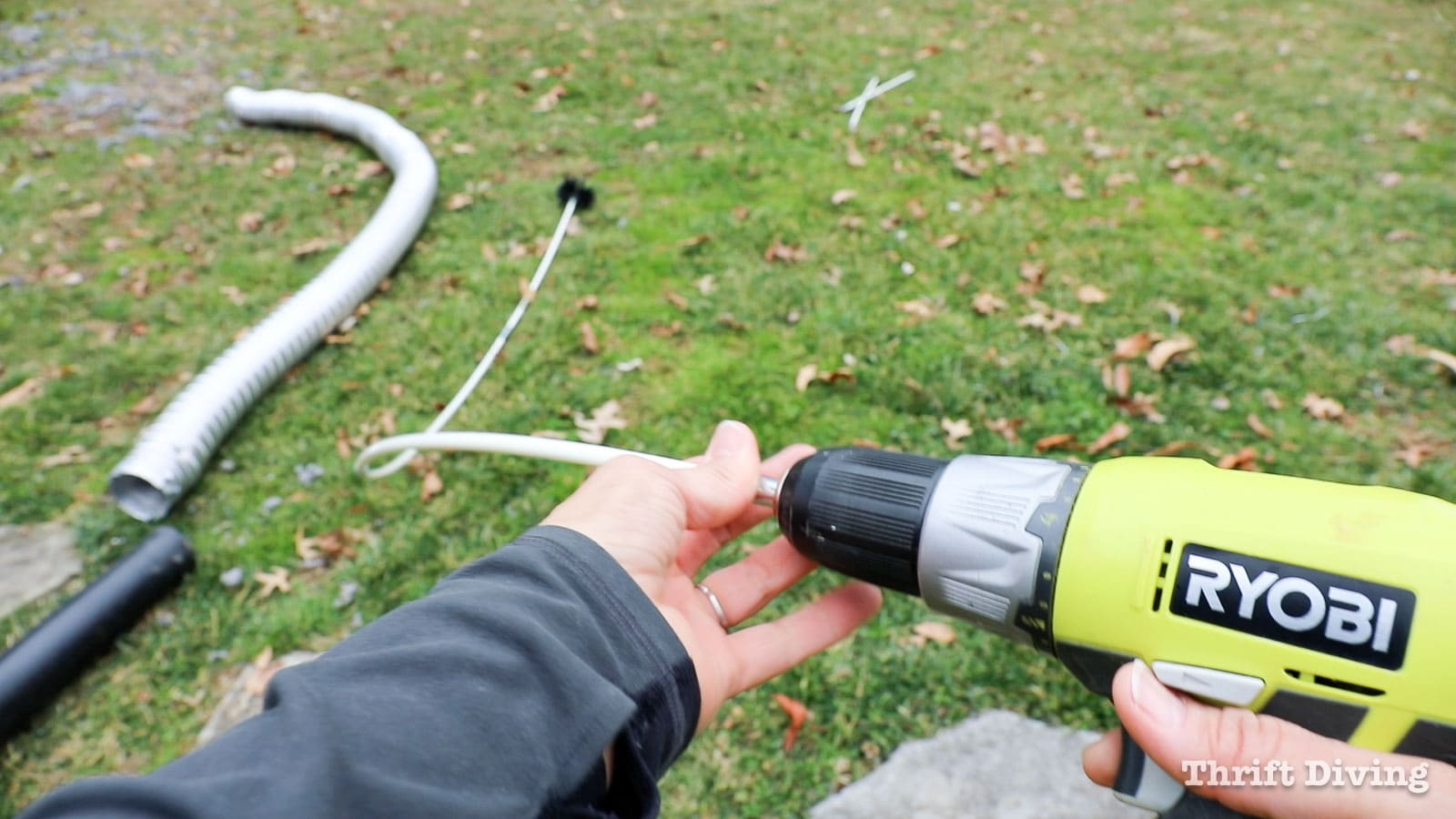 Dryer vent cleaning kit with extension rods and using a power drill. - 7 Home Maintenance Tasks - Thrift Diving