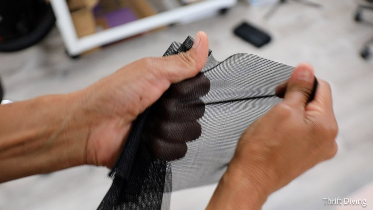 How to Make DIY Gazebo Screens - Phifer TuffScreen No-See-Um mesh screen being stretched to show that it will not tear.