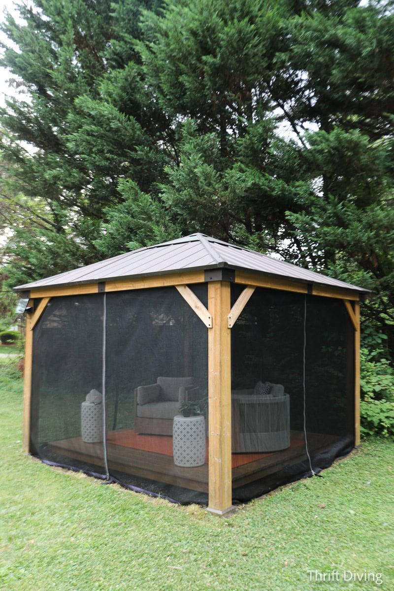 How to Make DIY Gazebo Screens - Sunjoy 11' x 11' wooden gazebo with DIY gazebo screens to keep mosquitos out while allowing airflow.