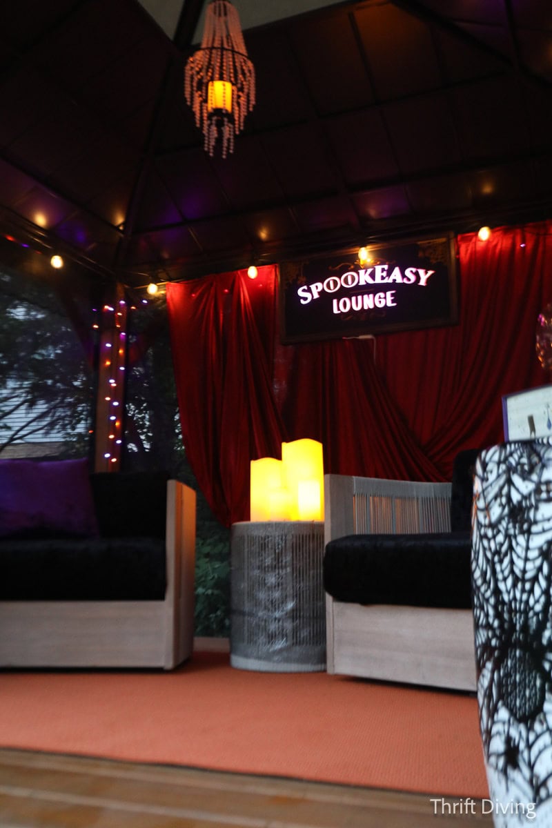 Cozy Halloween decorating for the backyard patio or gazebo with fabric and lighting.