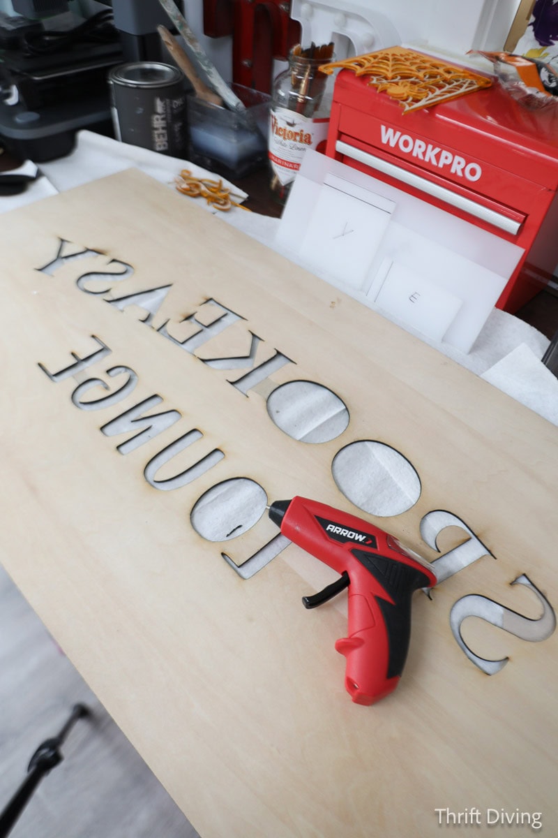 Laser engraved custom sign with glue gun.